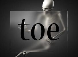 toe word on glass and skeleton photo