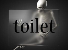 toilet word on glass and skeleton photo