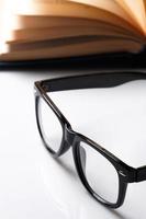 Eyeglasses and book