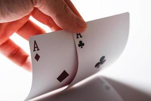 Man holding aces in hand photo