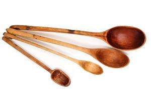 Wooden spoons on white background photo