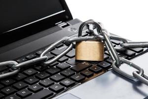 Padlock and chain on keyboard photo