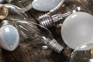 Lightbulbs on wooden background photo