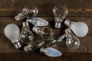 Lightbulbs on wooden background photo