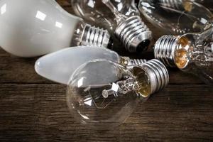 Lightbulbs on wooden background photo