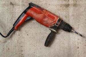 Drilling machine on concrete floor photo