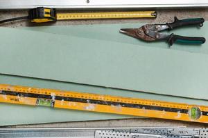 Instruments for build a plasterboard walls photo