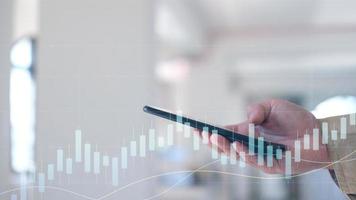 Hand using tablet and laptop analyzing sales data and economic growth graph chart. Business strategy. Digital marketing. Business innovation technology concept photo