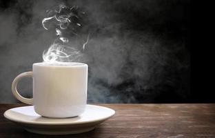 white coffee cup with steam photo