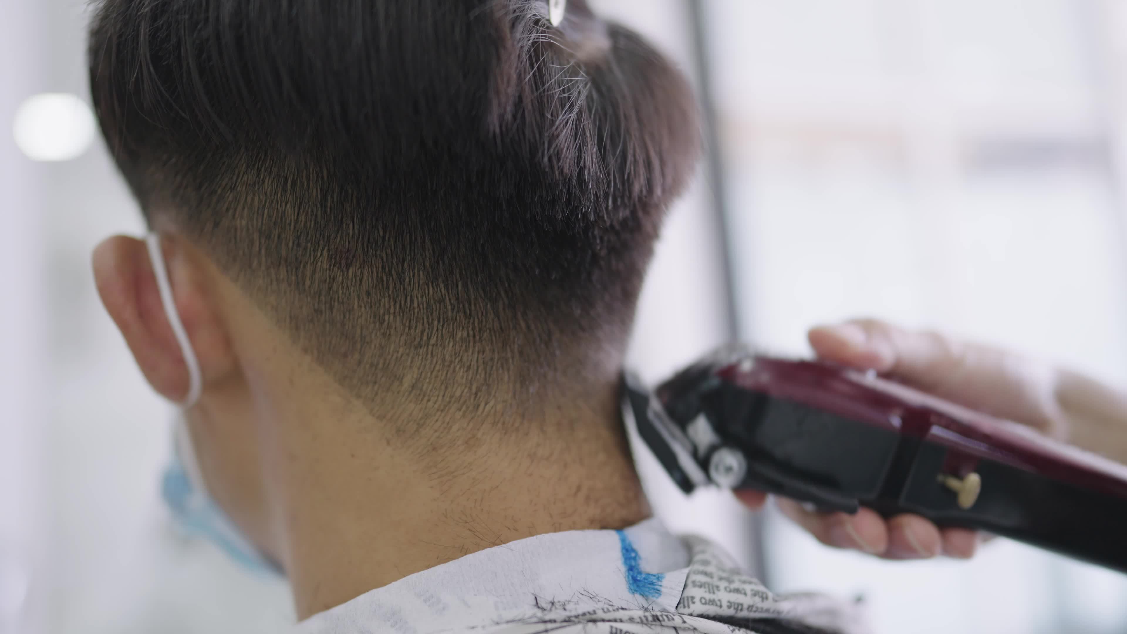 Close-up motion of hairdresser cuts hair with electric hair clipper, rear view of young client head at reopening barber, successful professional hairdresser cutting service, self care activities 7389131 Stock Video at Vecteezy Close-up motion of hairdresser cuts hair with electric hair clipper, rear view of young client head at reopening barber, successful professional hairdresser cutting service, self care activities 7389131 Stock Video at Vecteezy