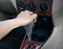 hand on automatic gear shift photo