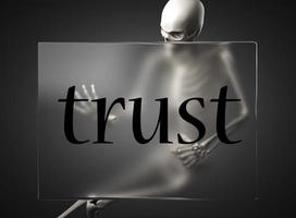 trust word on glass and skeleton photo
