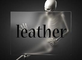 leather word on glass and skeleton photo