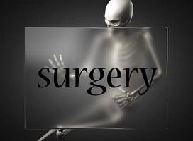 palabra de cirugía en vidrio y esqueleto foto