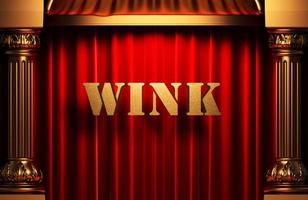 wink golden word on red curtain photo