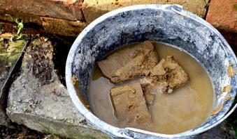 clay brick in bucket for construction house building architecture photo