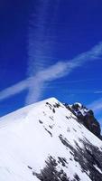 Titlis snow mountains peak vertical in Switzerland, Europe photo