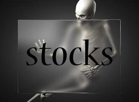 stocks word on glass and skeleton photo