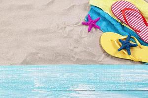 Sand copy space. Sand background top view.Beach towel, beach slippers and starfish photo