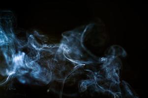abstract background of smoke or fog on black background photo