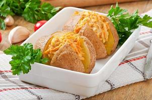 Baked potatoes stuffed with minced chicken and carrots photo