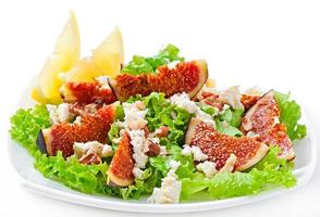 Green salad with figs, cheese and walnuts photo