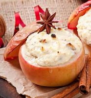 Baked apples with honey cream cheese, raisins and nuts photo