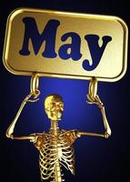 May word and golden skeleton photo