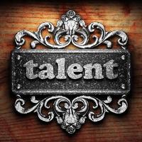 talent word of iron on wooden background photo