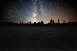 Desert silhouette and night sky photo