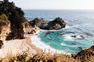 Blue ocean and rocky coast photo