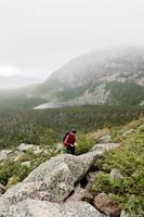 Person hiking in the mountains photo