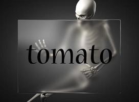 palabra de tomate en vidrio y esqueleto foto