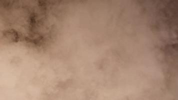 A close-up of the smoke in the dark background, the idea for abstract background. video