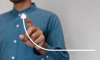 Businessmen wearing a light blue shirt to selecting the level of satisfaction score icons with copy space. Customer service experience and business satisfaction survey concept photo