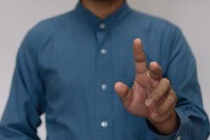 Young handsome man wearing light blue shirt  with different behaviors at work photo