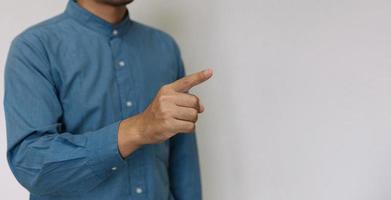 Young handsome man wearing light blue shirt  with different behaviors at work photo