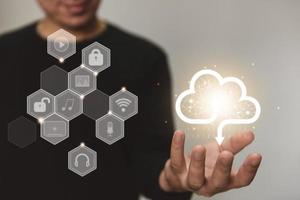 Businessman holding cloud data. Insurance Business computer security photo