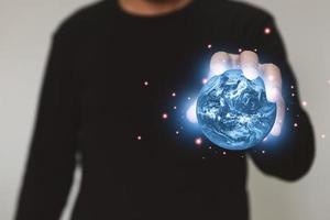 man holding earth. Elements of this image furnished by NASA photo