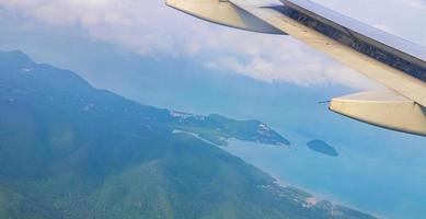 Flying over Thailand panoramic view of islands beaches turquoise waters. photo