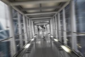 Corridors and running passengers Bangkok Suvarnabhumi Airport Thailand. photo