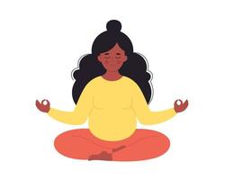 Black pregnant woman meditating in lotus pose. Healthy pregnancy, yoga