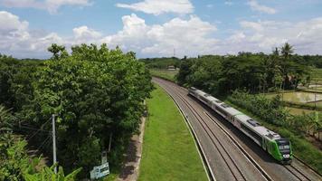 Aerial View of Passenger Train Passing by a Rail in Indonesia video