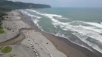 Aerial view of Sandy beach in sunny day in Yogyakarta, Indonesia video