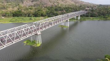 Aerial of long steel bridge in Indonesia
