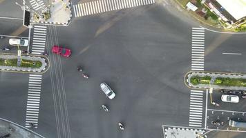 Drone shot on the street with intersections and cars in Indonesia video