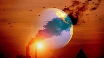 Concept of the world and pollution. The spinning world has a backdrop of smoke emissions. video