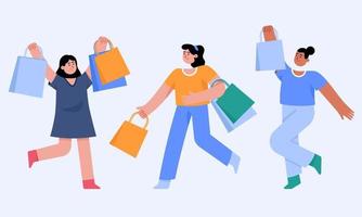 mujeres sosteniendo bolsas de la compra