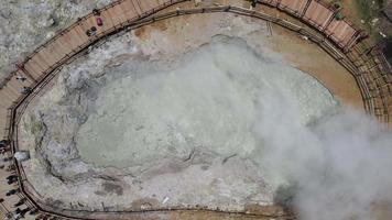 Aerial view of Sikidang crater with the background of sulfur vapor coming out of the sulfur marsh. video