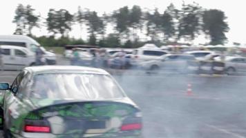 Drifting car, professional driver. Racing drift car with thick smoke from burning tires. Race car burnout. By car text in Russian physics of motion. Ukraine, Kiev - July 22, 2021. video
